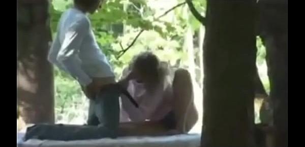  Cute teens make sextape perched precariously in the woods